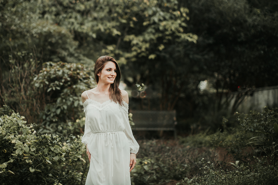 bride in a park smiling 