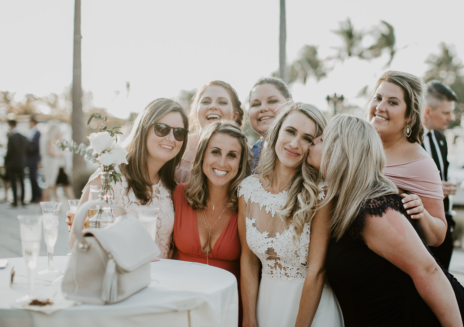bride with friends at sunset 