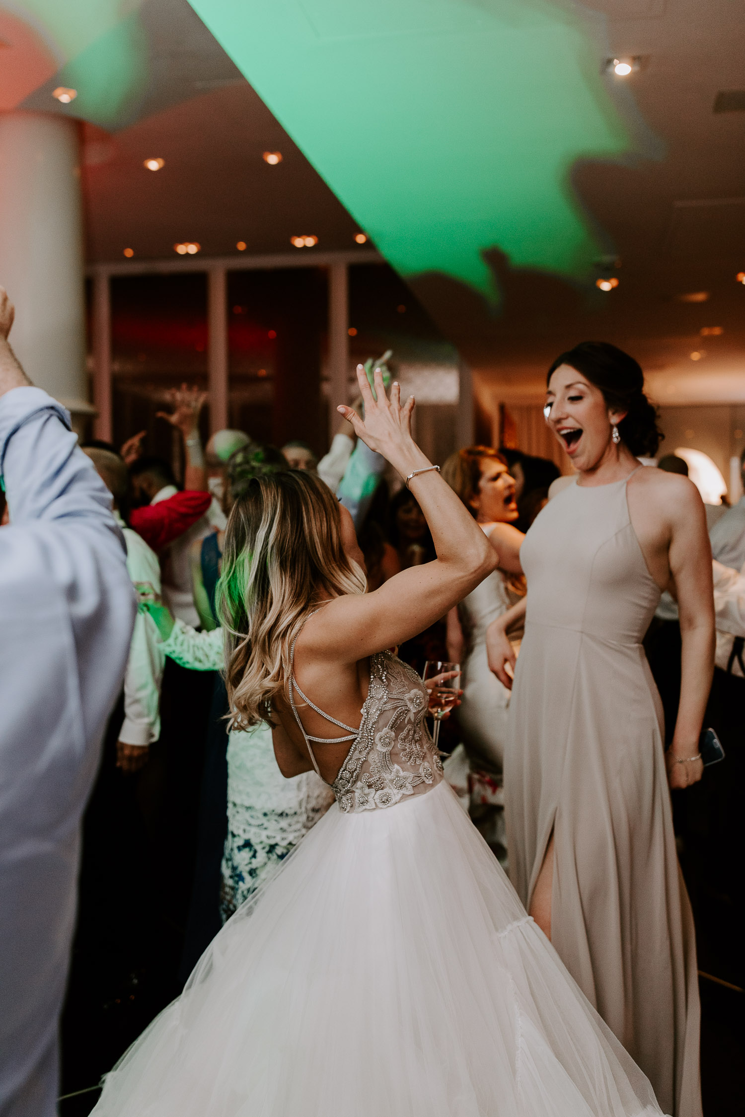 bride and bridesmaid dancing 