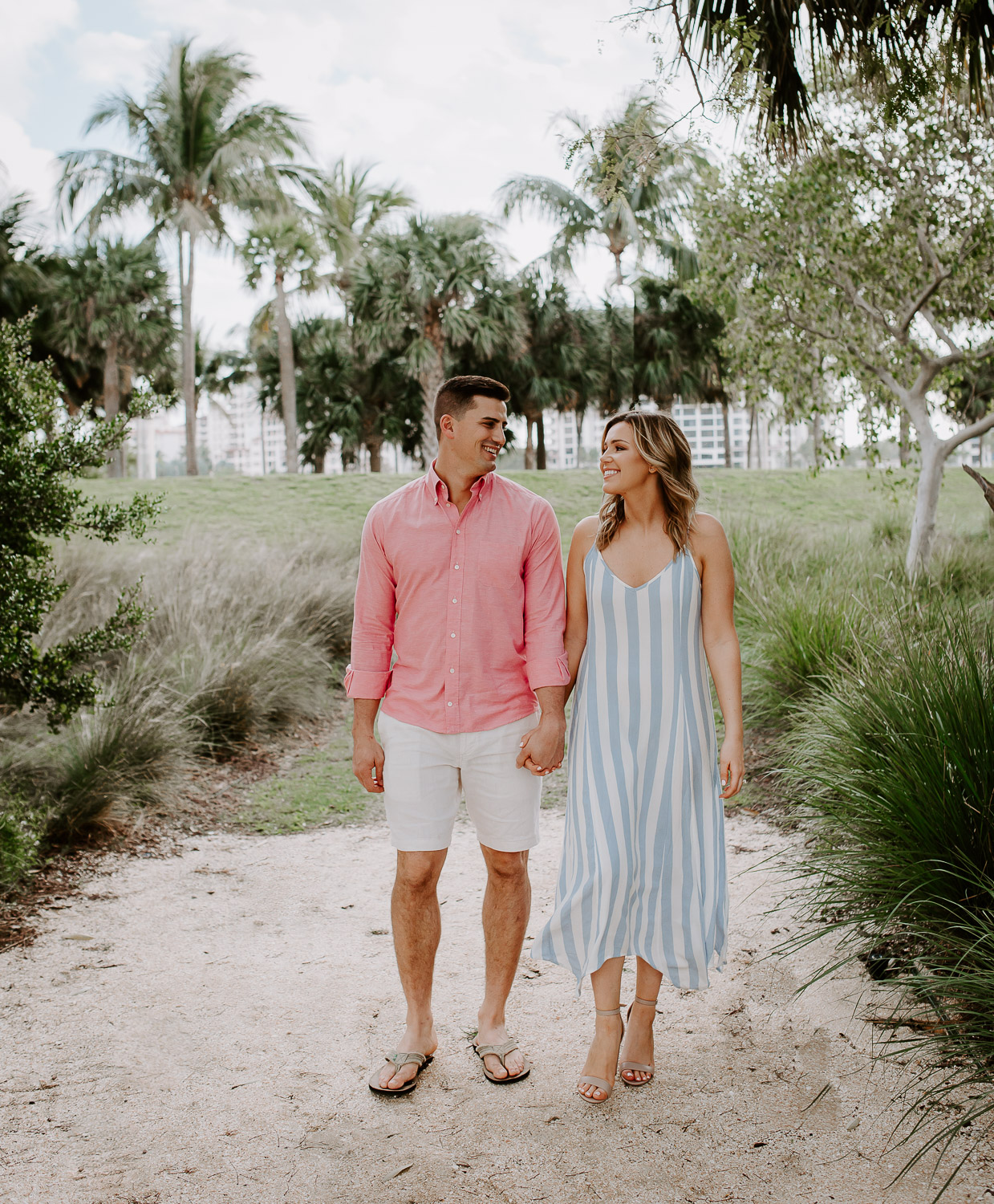 couple walking wearing pastel colors