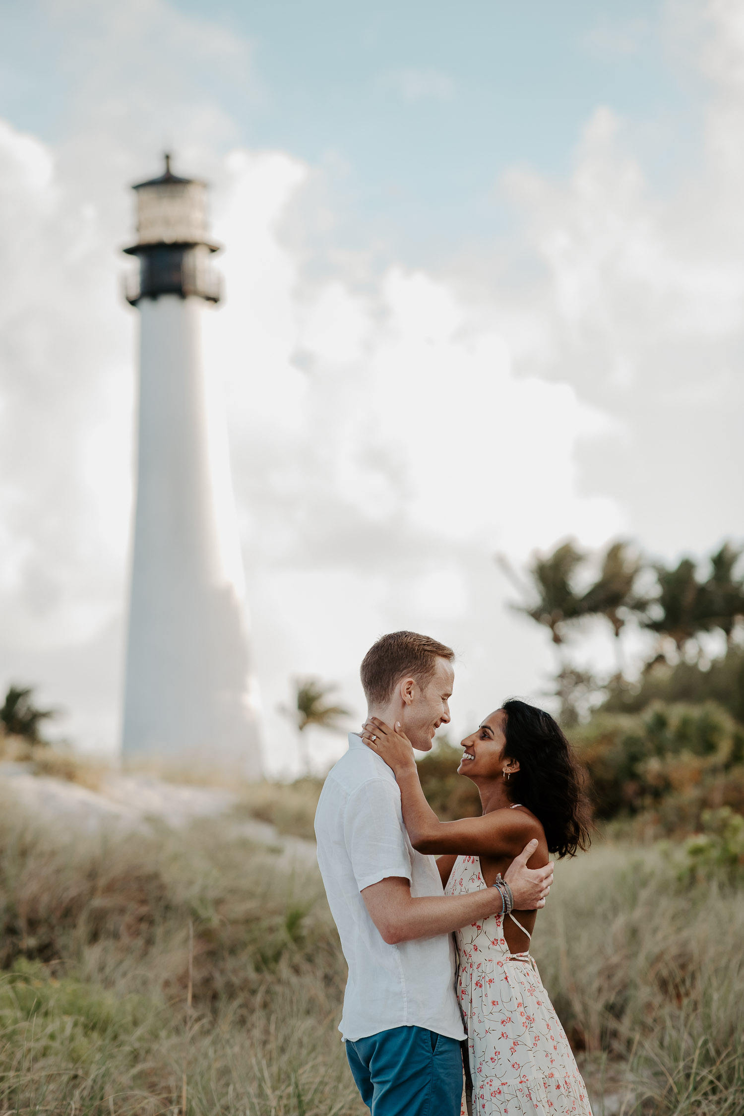 couple next to the lighthouse 