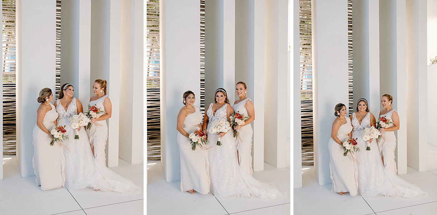 Portrait of Bride and bridesmaids with white floral bouquet Modern Elegant Wedding at The W South Beach captured by South Florida Wedding Photographer Erika Tuesta Photography