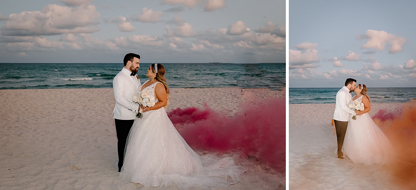 Cool portrait of Bride and Groom holding each other on the beach with magenta smoke Modern Elegant Wedding at The W South Beach captured by South Florida Wedding Photographer Erika Tuesta Photography