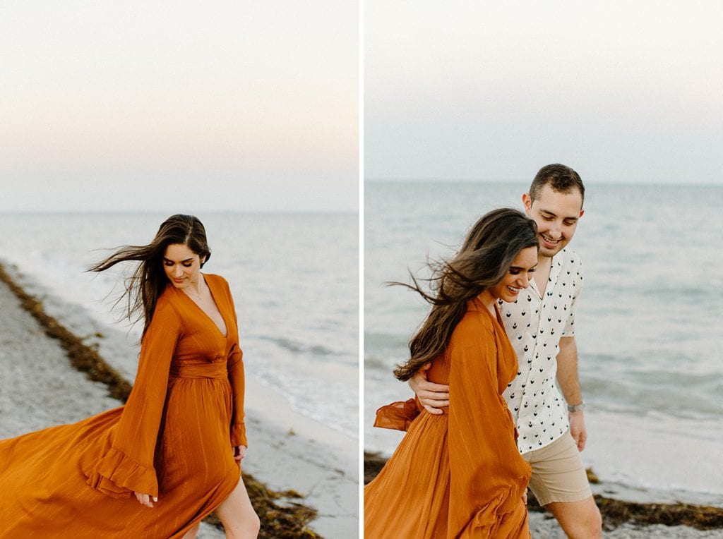 Couple walking along beach shoreline