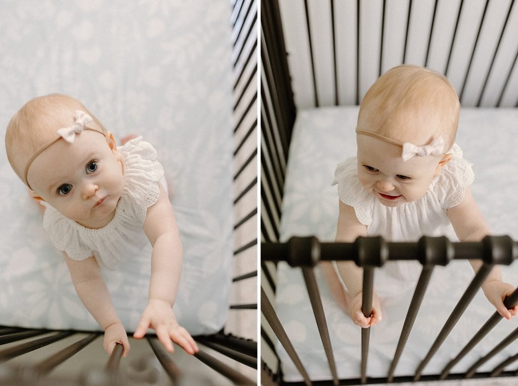 Toddler standing in crib laughing