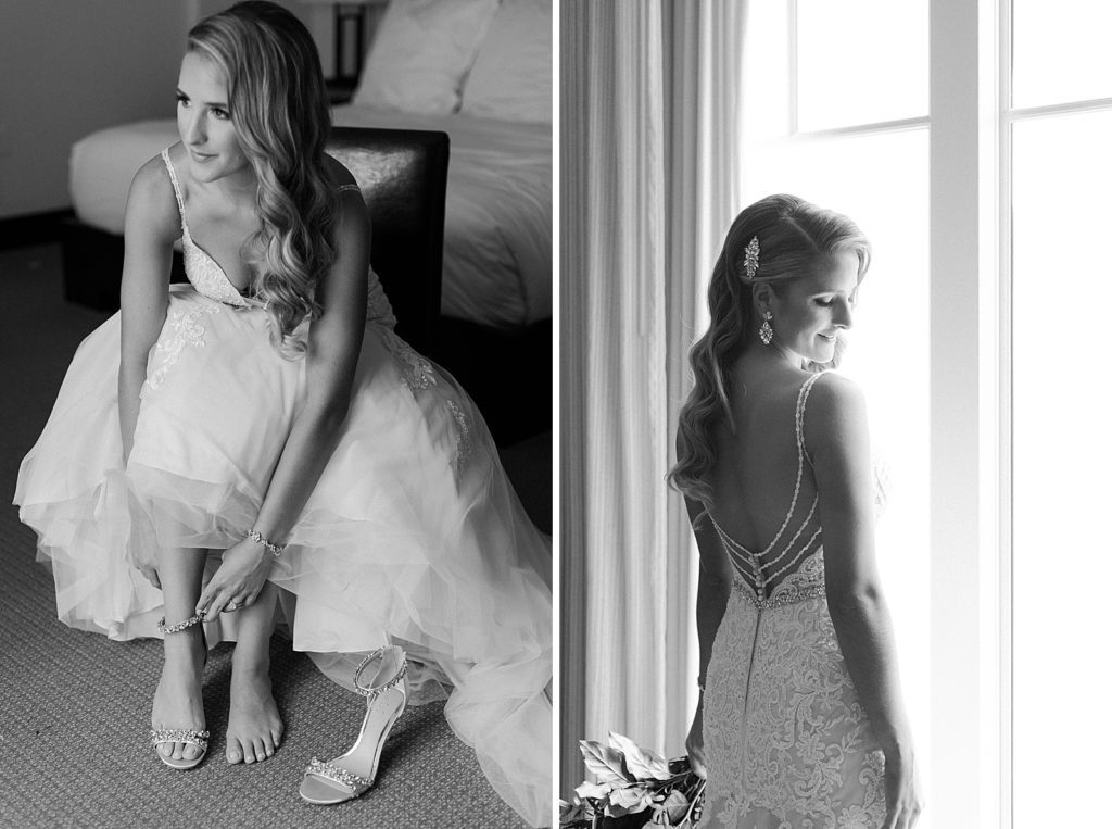 B&W Bride putting on heells and standing by the window