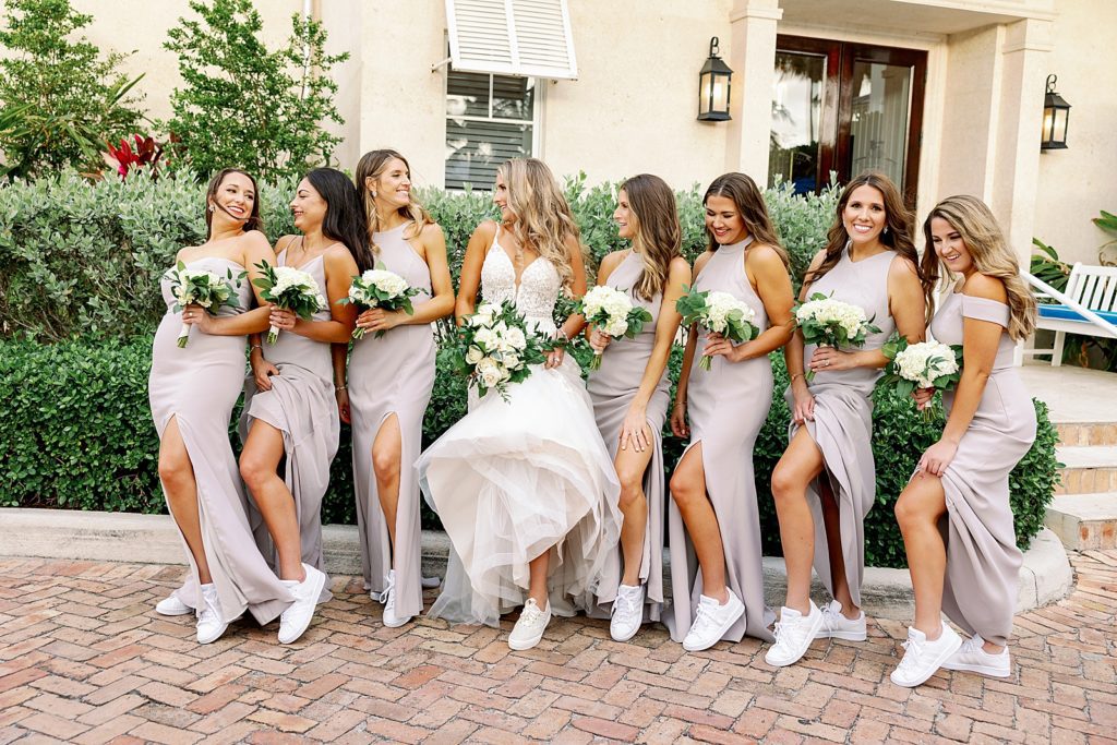 Bride and Bridesmaids showing off leg and casual sneakers