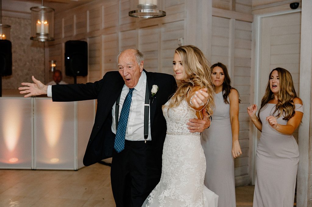 Bride dancing with family