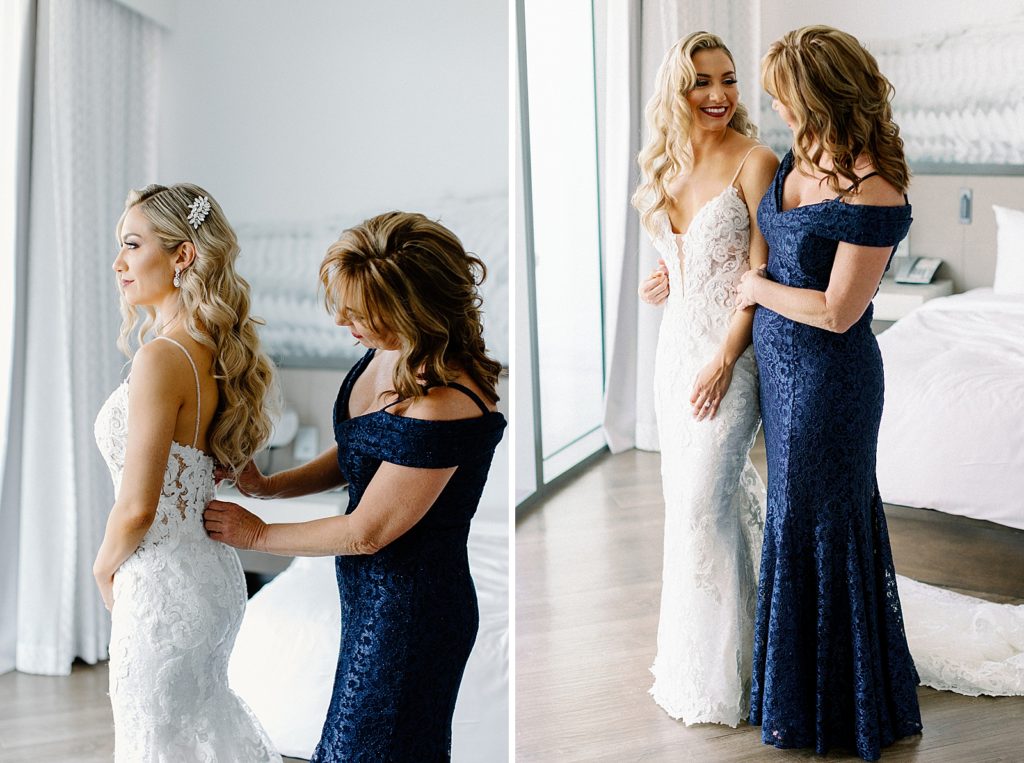 Mother buttoning wedding dress helping Bride getting ready