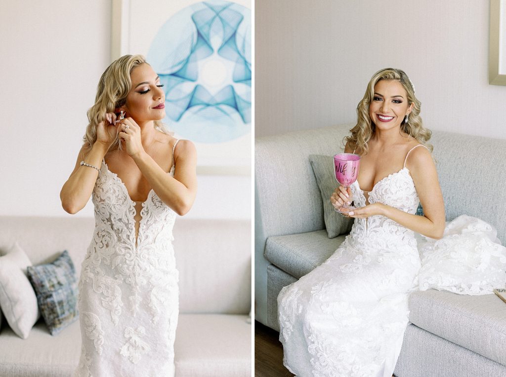 Bride putting earrings on and drinking from pink glass
