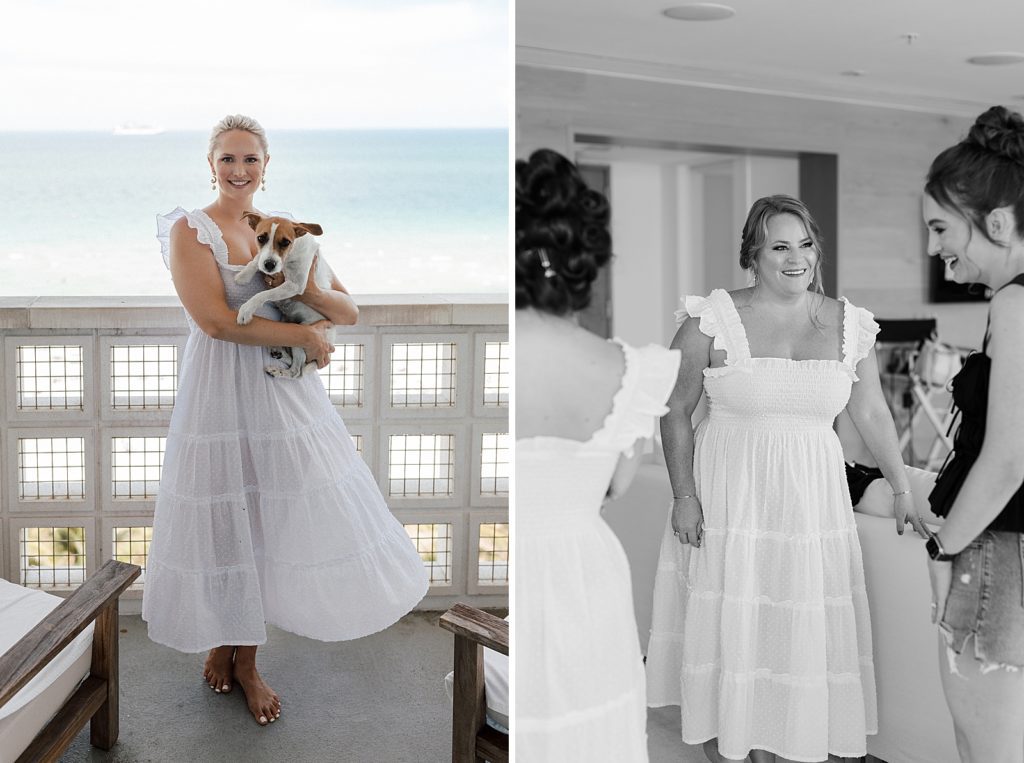 Bride on outdoor balcony holding dog with the ocean behind them