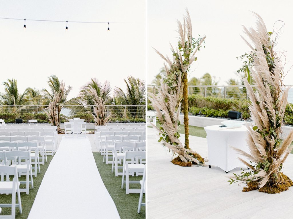 Outdoor Ceremony area with white folding chairs and white aisle runner