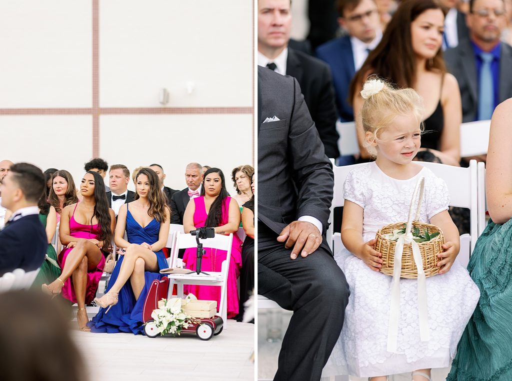 Guests and flower girl sitting watching Ceremony