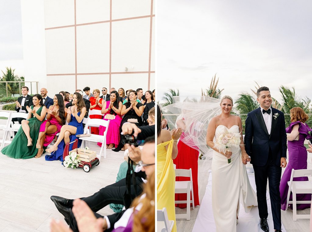 Guests clapping for just married Bride and Groom while they hold hands and exit Ceremony