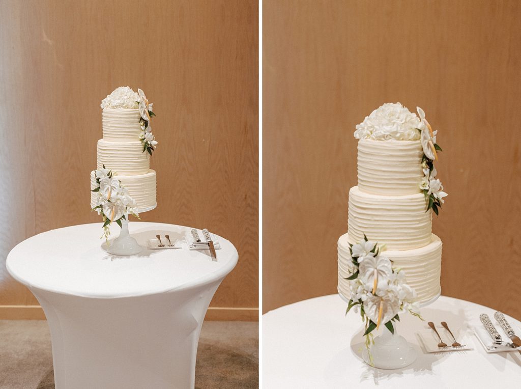 Detail shot of light floral decor wedding cake