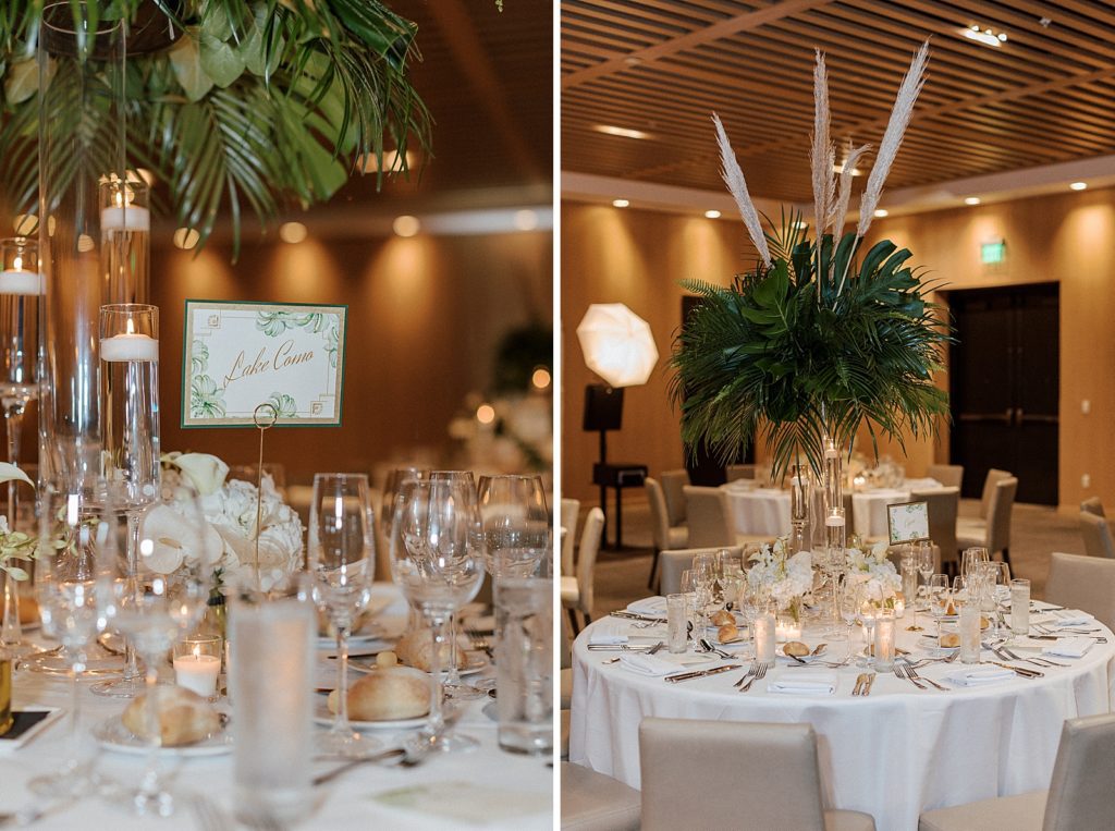 Detail shot of table names and green palm leaf centerpieces
