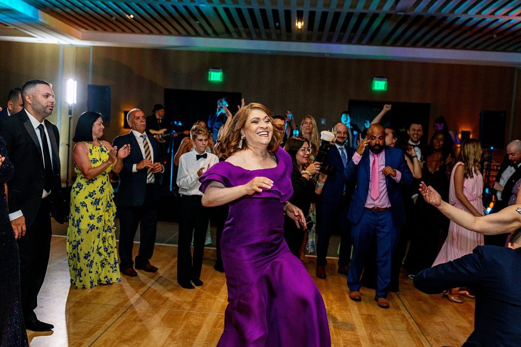 Mother of Groom dancing in dance circle at Wedding Reception