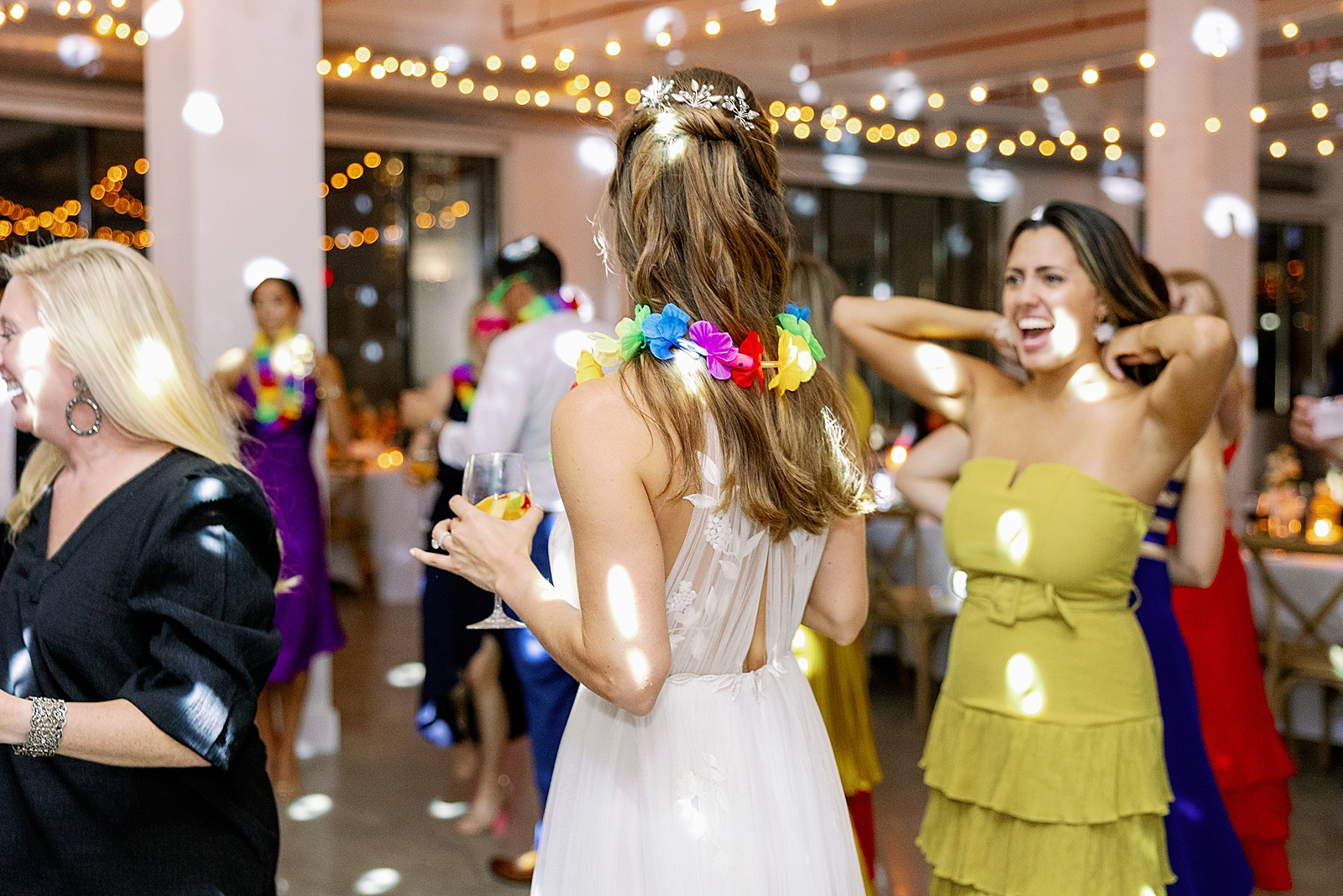 Bride dancing with guests for indoor Reception