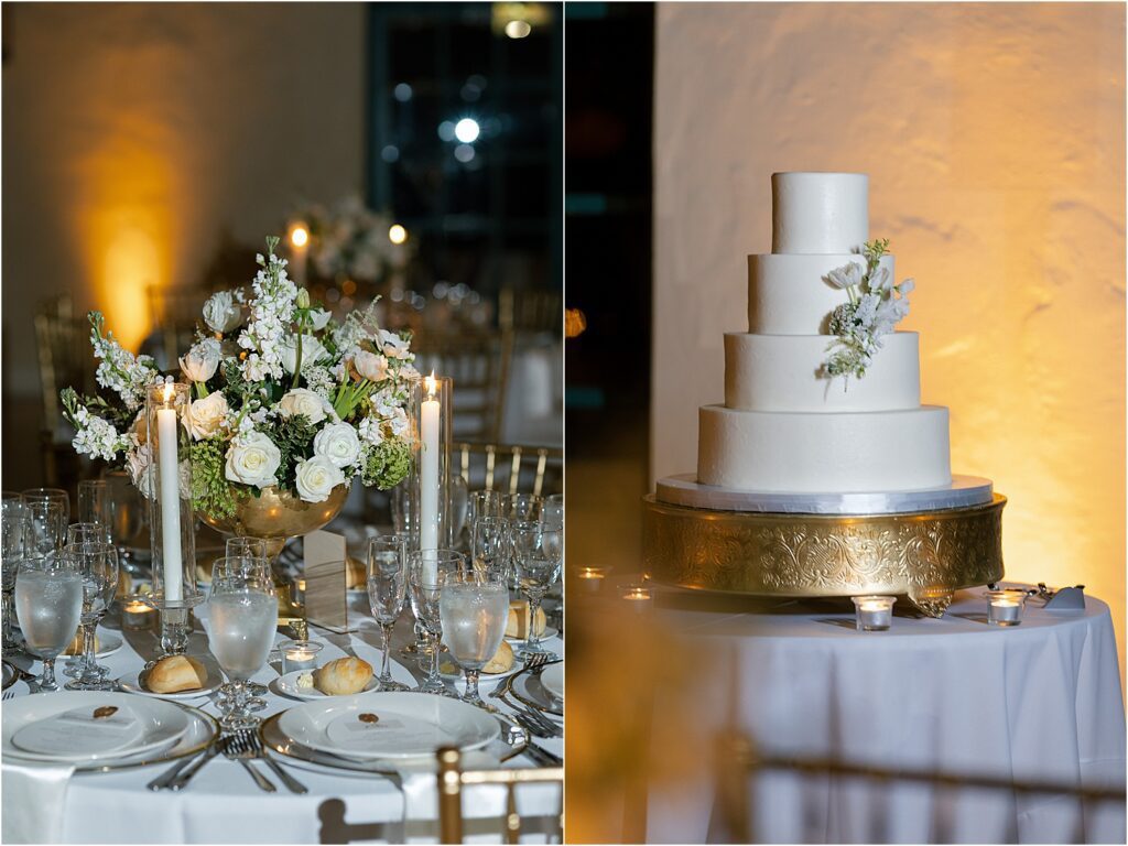 Four-tier white wedding cake with delicate white flowers on gold stand